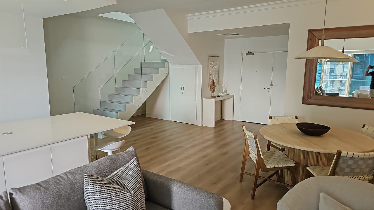 Living area and glass staircase